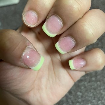 VS Nail Bar - So poorly. She Didn't even take the time to do it right - A hand with fingernails showing uneven nail polish application and damage, including peeling and rough edges. - Nail Salons Near Me - Phoenix, Arizona
