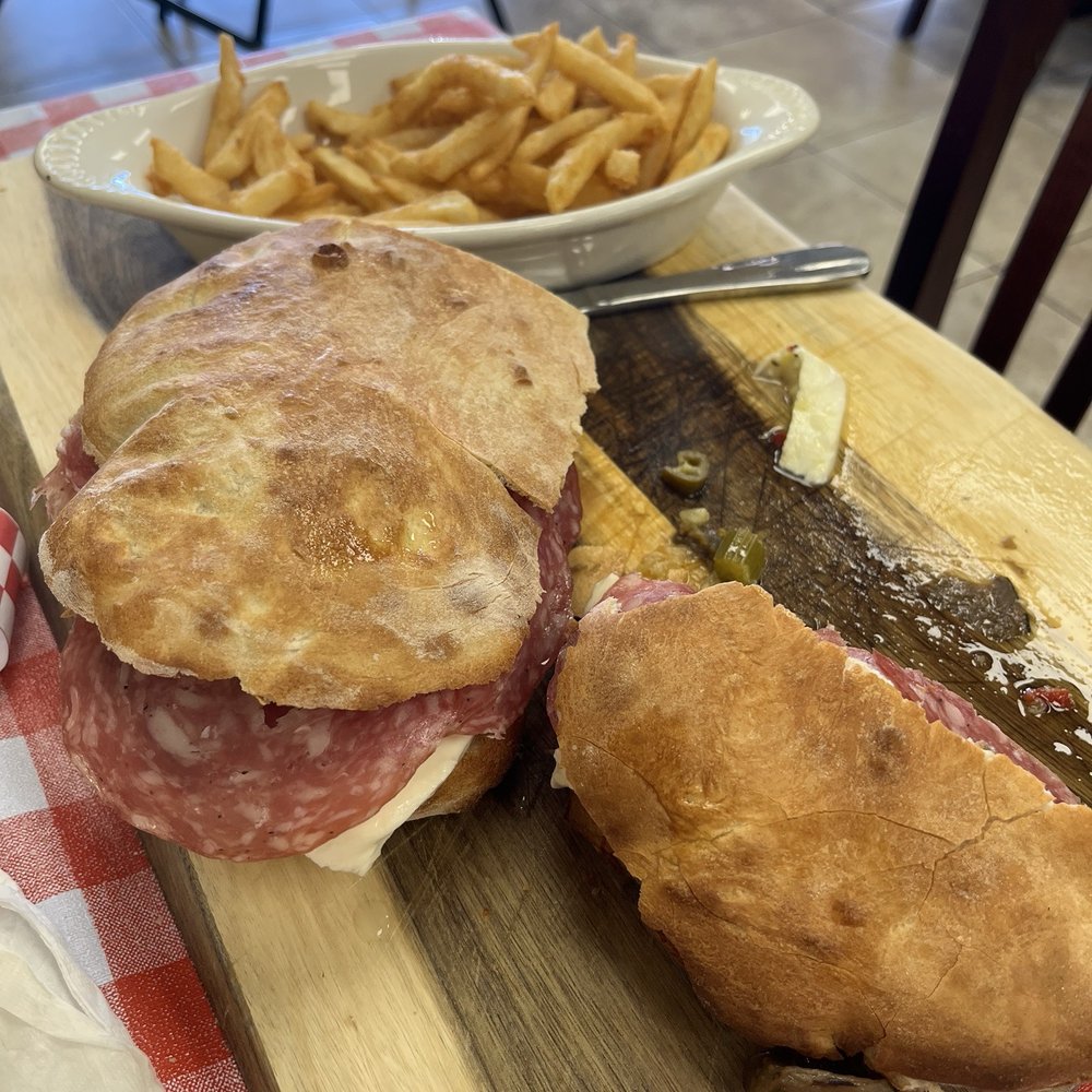 scicillia sandwich with fries. scicillia sandwich with fries.