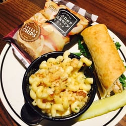 Corner Bakery Cafe - 1/2 chicken pesto, side of Mac and cheese, chips & pickle