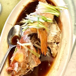 Gourmet Village - Steamed red rock cod with ginger and scallions.