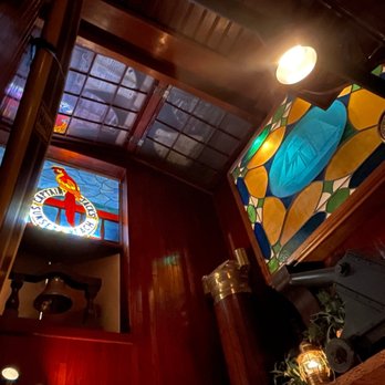 Captain Jack's - Kitschy Decor above the host table near the bar - Seafood Near Me - Sunset Beach, California