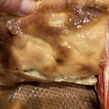 Rosati's Chicago Pizza - Close up of a grease soaked crust - Pizza Near Me - Louisville, Colorado Rosati's Chicago Pizza - Close up of a grease soaked crust - Pizza Near Me - Louisville, Colorado