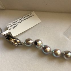 Gem Shopping Network - I received this blue Akoya pearl necklace today . Notice that black chip near the clasp? Very disappointing .