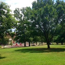 Large grassy areas with shade trees