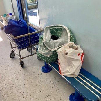 Big Waves Laundromat - A woman had put some of her things on the only two benches. - Laundry Services Near Me - Santa Monica, California Big Waves Laundromat - A woman had put some of her things on the only two benches. - Laundry Services Near Me - Santa Monica, California