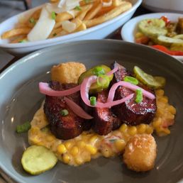 Pan Seared Pork Belly ,in the front and truffle fries in the back ou and their house pickled small plate. Pan Seared Pork Belly ,in the front and truffle fries in the back ou and their house pickled small plate.