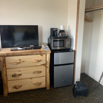 Discovery Lodge - My lunch bag and piece of trash on floor but that is the mini fridge and microwave and tv. - Hotels Near Me - Estes Park, Colorado