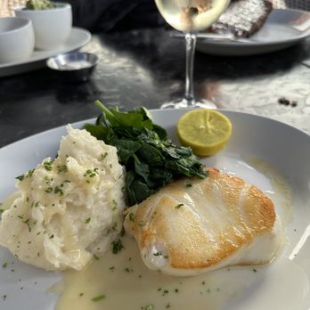 Nick's Manhattan Beach - Pan seared Chilean sea bass with lemon beurre blanc, sauteed spinach and garlic, whipped potatoes - American Near Me - Manhattan Beach, California Nick's Manhattan Beach - Pan seared Chilean sea bass with lemon beurre blanc, sauteed spinach and garlic, whipped potatoes - American Near Me - Manhattan Beach, California