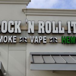 Rock 'N Roll It Smoke, Vape & Hemp - Sign above storefront