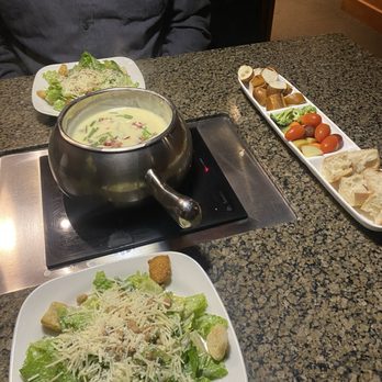 The Melting Pot - Caesar salad and Classic Alpine Cheese Fondue - Fondue Near Me - Minneapolis, Minnesota The Melting Pot - Caesar salad and Classic Alpine Cheese Fondue - Fondue Near Me - Minneapolis, Minnesota