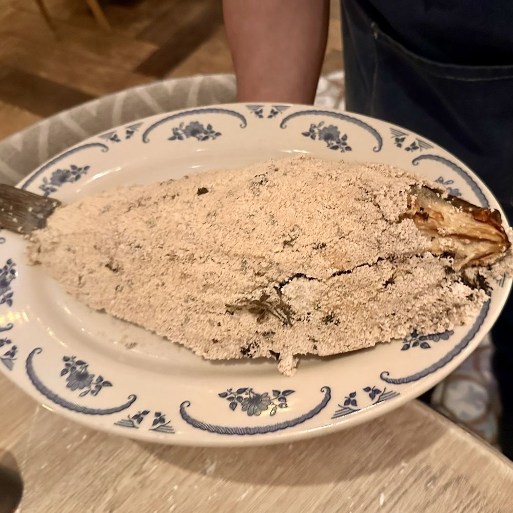 Naxos Taverna - Branzino oven cooked in salt.. presented before taking it back to debone - Greek Near Me - Las Vegas, Nevada Naxos Taverna - Branzino oven cooked in salt.. presented before taking it back to debone - Greek Near Me - Las Vegas, Nevada