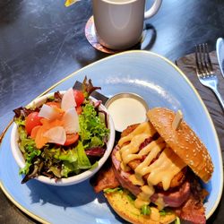 Personas Patio Restaurant And Lounge - Wicked Tuna Club $22 (+ $1 substitute fries with green salad) Seared ahi tuna, bacon, arugula, onion ring, red pepper jam, brioche bun