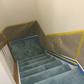 Stairways by Rogers - Paper and tape protection I added to the upper flight of stairs before the second day of work. - Carpenters Near Me