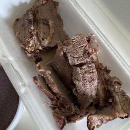 Grey brisket and supermarket sausage. Grey brisket and supermarket sausage.