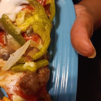 Marco's Pizza - a person holding a plate of food - Pizza Near Me - Opelika, Alabama