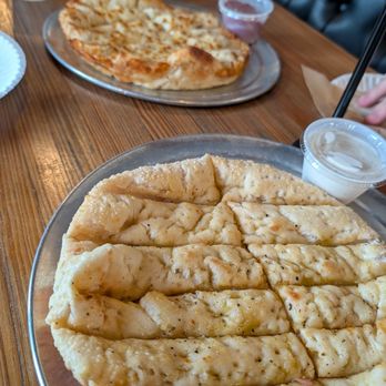 Aviator Pizza & Drafthouse - Focaccia Bread Sticks both without and with Cheese - Pizza Near Me - Kyle, Texas Aviator Pizza & Drafthouse - Focaccia Bread Sticks both without and with Cheese - Pizza Near Me - Kyle, Texas