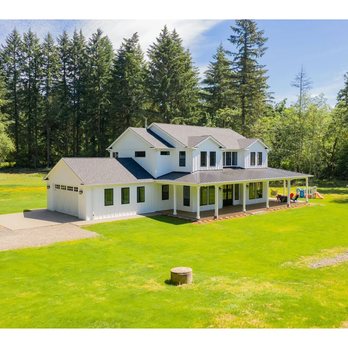Ivy Contracting - Classic farm style wrap around porch - General Contractors Near Me