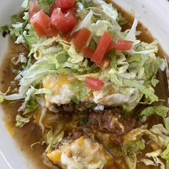 McCarty's Cafe - Smothered burrito. In: refried beans, seasoned ground beef, chilies & cheese. Top: choice of red/green sauce, cheese, lettuce & tomatoes. - American Near Me - Portales, New Mexico McCarty's Cafe - Smothered burrito. In: refried beans, seasoned ground beef, chilies & cheese. Top: choice of red/green sauce, cheese, lettuce & tomatoes. - American Near Me - Portales, New Mexico