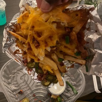 Chili's - a hand picking up some fries - Bars Near Me - North Olmsted, Ohio Chili's - a hand picking up some fries - Bars Near Me - North Olmsted, Ohio