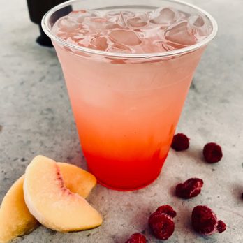 GOAT Coffee - a drink in a plastic cup with ice and raspberries - Coffee & Tea Near Me - Camrose, Alberta GOAT Coffee - a drink in a plastic cup with ice and raspberries - Coffee & Tea Near Me - Camrose, Alberta