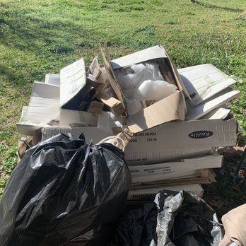 Strategic Property Services - a pile of garbage in a yard - General Contractors Near Me - Plano, Texas