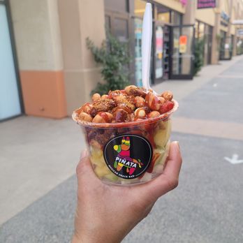 Piñata Mexican Snack Bar - a hand holding a bowl of food - Desserts Near Me - San Ysidro, California Piñata Mexican Snack Bar - a hand holding a bowl of food - Desserts Near Me - San Ysidro, California