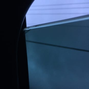 Firehouse Window Tint - See the tint creased in the corner - Auto Glass Services Near Me - Jacksonville, Florida Firehouse Window Tint - See the tint creased in the corner - Auto Glass Services Near Me - Jacksonville, Florida