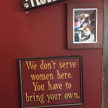 Side Door Cafe - a picture of a dog and a sign that says, we don't serve women here you have to bring - American Near Me - Albany, New York Side Door Cafe - a picture of a dog and a sign that says, we don't serve women here you have to bring - American Near Me - Albany, New York