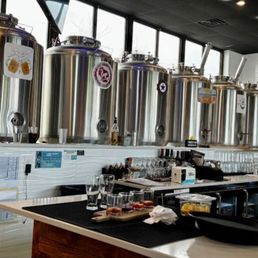 Large brewing tanks filled with craft beer.
