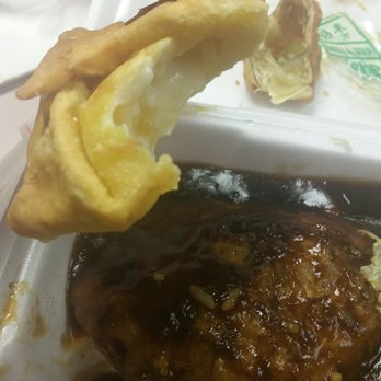 New Tea Garden Chop Suey - a hand holding a piece of food - Chinese Near Me - Chicago, Illinois