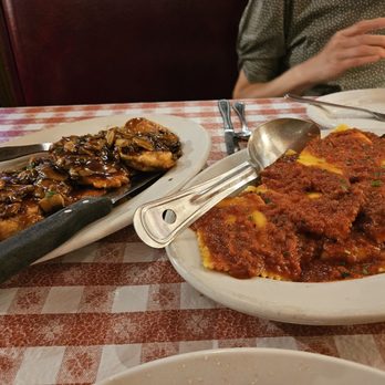 Buca di Beppo Italian Restaurant - That's Chicken Marsala, drowning in sauce on the left. On the right, is Ravioli Pomodoro. - Italian Near Me - Lombard, Illinois Buca di Beppo Italian Restaurant - That's Chicken Marsala, drowning in sauce on the left. On the right, is Ravioli Pomodoro. - Italian Near Me - Lombard, Illinois