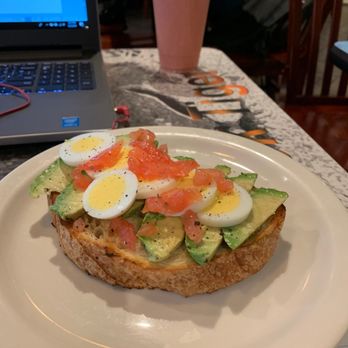 Lestat's Hillcrest - Avocado toast and strawberry fields in the background - Coffee & Tea Near Me - San Diego, California
