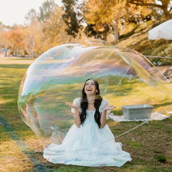 Coast 2 Coast Bubbles - Bubble Girl Jenna, our Los Angeles based artist. She is inside our giant bubble. Another trick we do at parties! - Party Equipment Rentals Near Me Coast 2 Coast Bubbles - Bubble Girl Jenna, our Los Angeles based artist. She is inside our giant bubble. Another trick we do at parties! - Party Equipment Rentals Near Me