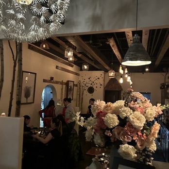 The Rose - a vase of flowers in a restaurant - Cocktail Bars Near Me - Edwards, Colorado