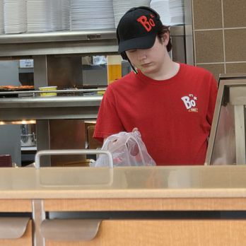 Bojangles - The employee in charge of the drive-thru, very efficiently prepares the order of one of the cars waiting at the pick-up window. - Southern Near Me - Vinton, Virginia