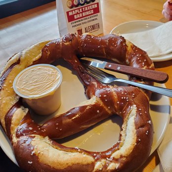 Maple Tavern - Pretzel the size of a hubcap with cheese ($10) - American Near Me - Maple Grove, Minnesota
