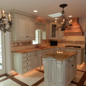 Newline Design Center - Kitchen remodel with copper hood. New cabinets, granite and fixture. New floor with travertine tile and wood border. - General Contractors Near Me - Orland Park, Illinois Newline Design Center - Kitchen remodel with copper hood. New cabinets, granite and fixture. New floor with travertine tile and wood border. - General Contractors Near Me - Orland Park, Illinois