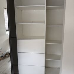 Shauna Fox Permanent Cosmetics - Dresser drawers and cupboard for stacking items.