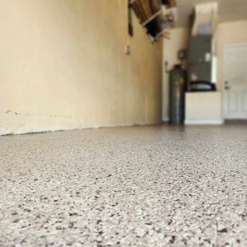 4 Two Epoxy - a garage floor with a garage in the background - Flooring Near Me 4 Two Epoxy - a garage floor with a garage in the background - Flooring Near Me