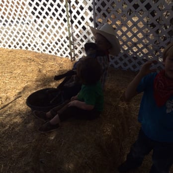 Calicinto Ranch - Kids with the chickens and baby lambs - Ranches Near Me