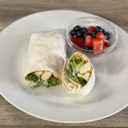 Old World Cafe - Our buffalo chicken wrap with a side of fresh fruit