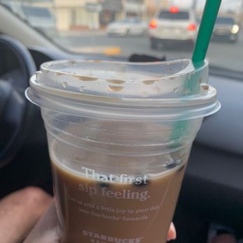 Starbucks - I ordered a Carmel macchiato with soy milk and I looked down at my drink and there's three coffee beans floating in my drink. - Coffee & Tea Near Me - Torrance, California