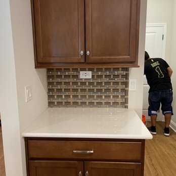 North Florida Floors - a man working on a kitchen counter - Flooring Near Me North Florida Floors - a man working on a kitchen counter - Flooring Near Me