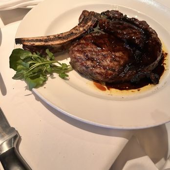 The Capital Grille - Porcini-Rubbed Bone-In Ribeye with 15-Year Aged Balsamic - Steakhouses Near Me - Chevy Chase, Maryland The Capital Grille - Porcini-Rubbed Bone-In Ribeye with 15-Year Aged Balsamic - Steakhouses Near Me - Chevy Chase, Maryland