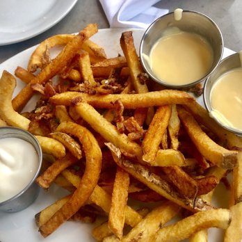 Zinburger - Loaded Fries with cheese sauce and sour cream. - Burgers Near Me - Tucson, Arizona Zinburger - Loaded Fries with cheese sauce and sour cream. - Burgers Near Me - Tucson, Arizona