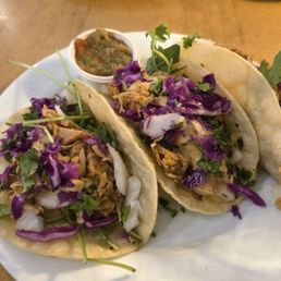 Chipotle jackfruit tacos with green salsa on the side Chipotle jackfruit tacos with green salsa on the side