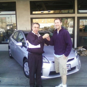 Cabe Toyota - Sales Consultant Ron Aleman handing us the keys to our new 2011 Prius. - Car Dealers Near Me - Long Beach, California