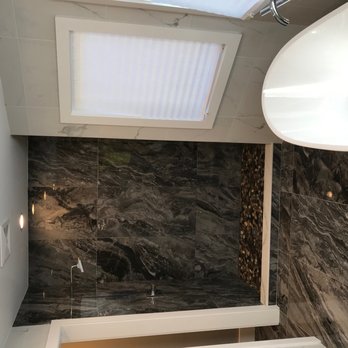 J&E Plumbing & Heating - a bathroom with a skylight - Plumbing Near Me - Baldwin, New York