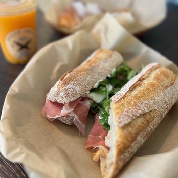 Dolce Aroma Italian Bakery - Baguette sandwich with prosciutto di parma, cream cheese, fig spread, arugula, and mozzarella - Gelato Near Me - Carlsbad, California Dolce Aroma Italian Bakery - Baguette sandwich with prosciutto di parma, cream cheese, fig spread, arugula, and mozzarella - Gelato Near Me - Carlsbad, California