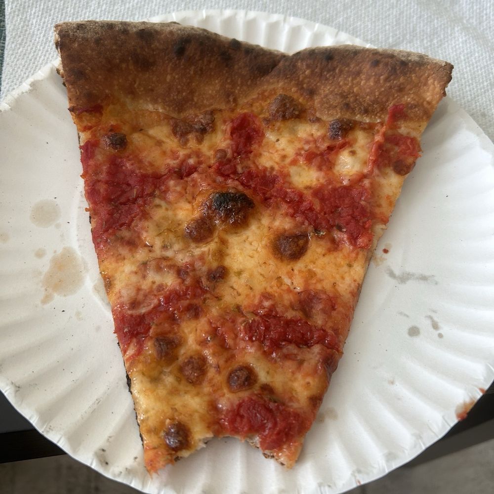 Cheese pizza slice took a bite couldn't wait. Cheese pizza slice took a bite couldn't wait.